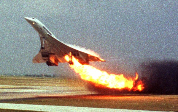 FILE - In this July 25, 2000, Air France Concorde flight 4590 takes off with fire trailing from its engine on the left wing from Charles de Gaulle airport in Paris. A French court has found Monday Dec.6, 2010, that Continental Airlines, Inc. and one of its mechanics, John Taylor, guilty in connection with the 2000 crash of the Concorde jet outside Paris which killed 113 people. (AP Photo/Toshihiko Sato, File) MANDATORY CREDIT PHOTOGRAPHER TOSHIHIKO SATO JAPAN OUT France Concorde Crash